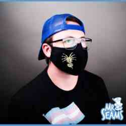 A man wearing a Xenomorph Face Hugger Alien Face Mask.