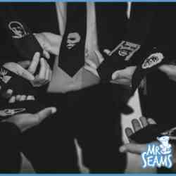 A black and white photo of a group of people wearing Custom Wedding Ties.