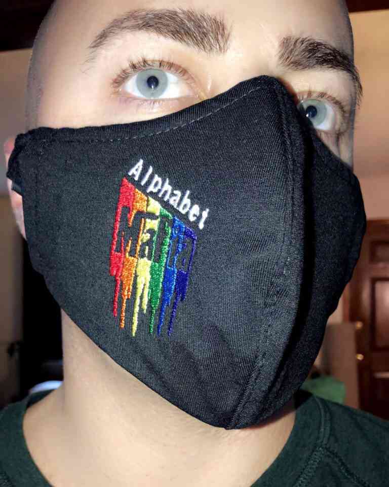 A man wearing an Alphabet Mafia Face Mask.