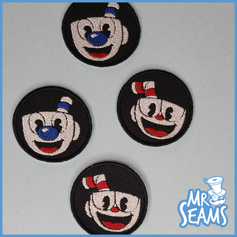 Four mr seams embroidered patches on a black background.