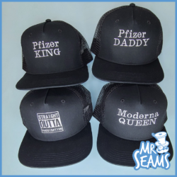 Four vaccinated beanies & hats with the words king and daddy.