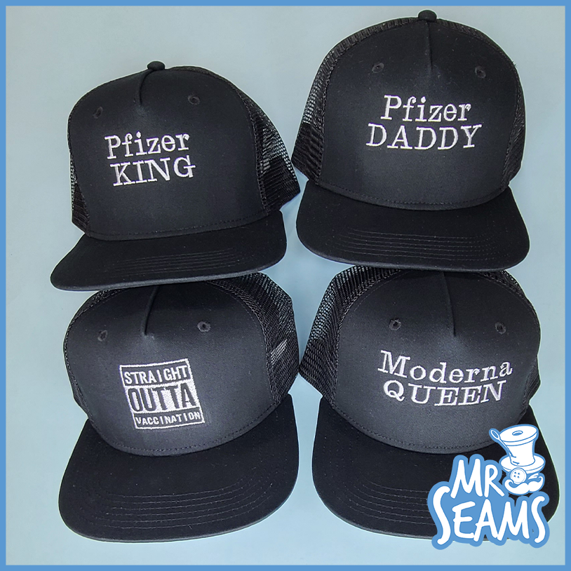 Four vaccinated beanies & hats with the words king and daddy.
