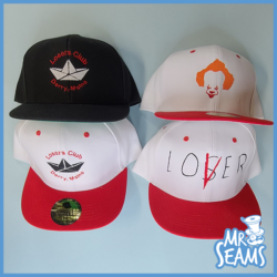 Four "IT" Pennywise Beanies Hats with different designs on them.