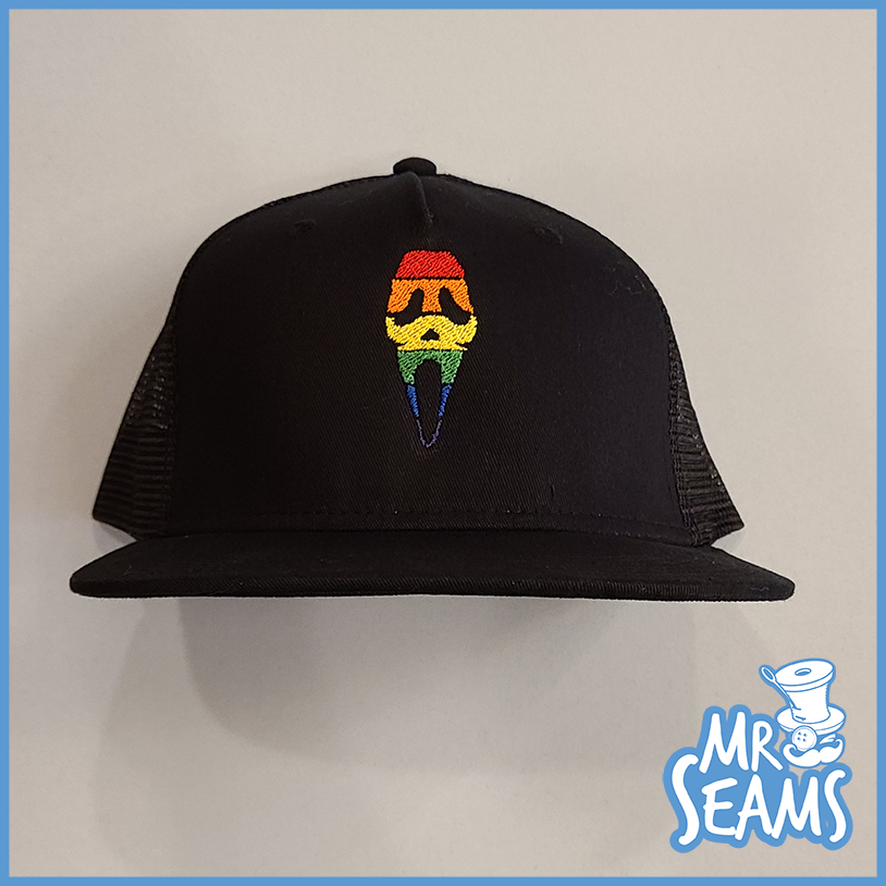 A black hat adorned with a rainbow hat, perfect for showcasing your pride in Scream Pride Beanies & Hats.