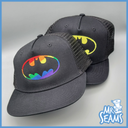 Two Batman logos on a black Batman Pride Beanies & Hats.