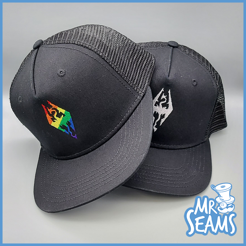 Two black Skyrim Pride Beanies & Hats with the words Mr. Seams on them.