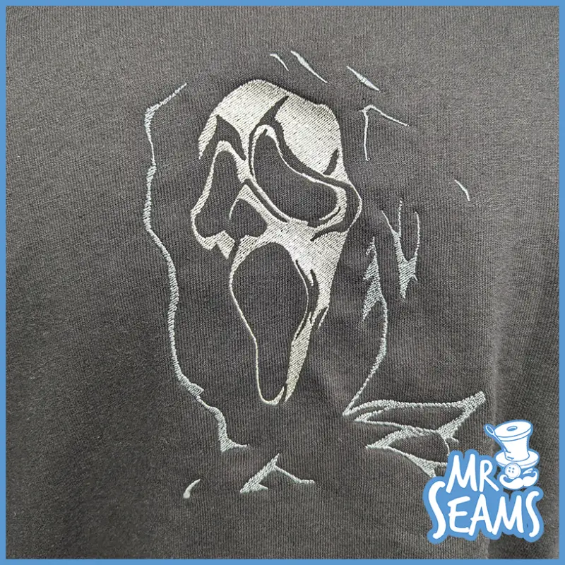 A Ghost Face Horror Hoodie with a scream face on it, perfect for horror lovers.