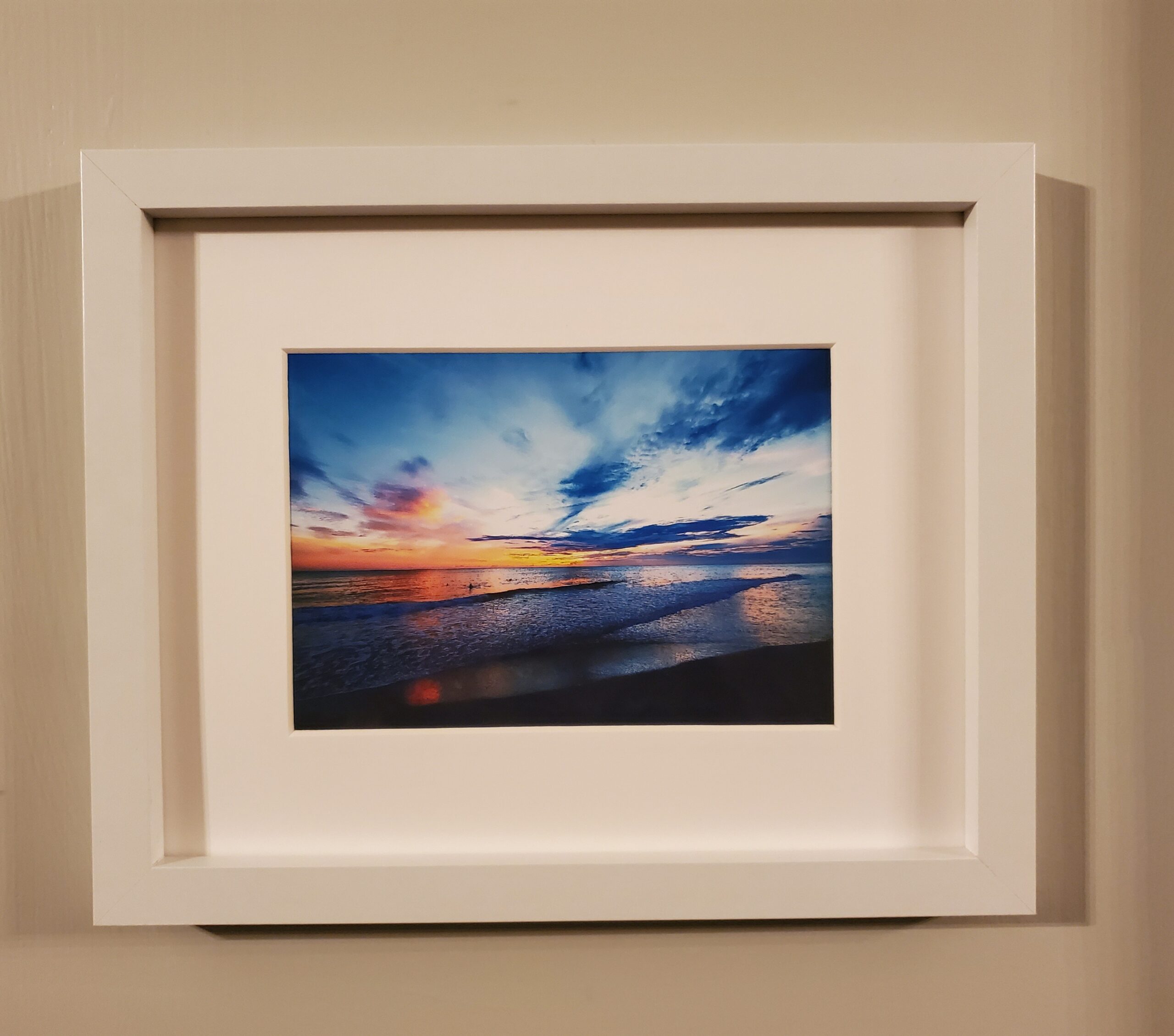 A captivating photo of Sunset's @ Captiva Island, beautifully framed on a wall.