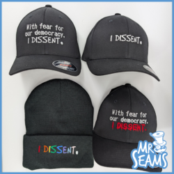 Black hats and beanie with dissent messages.