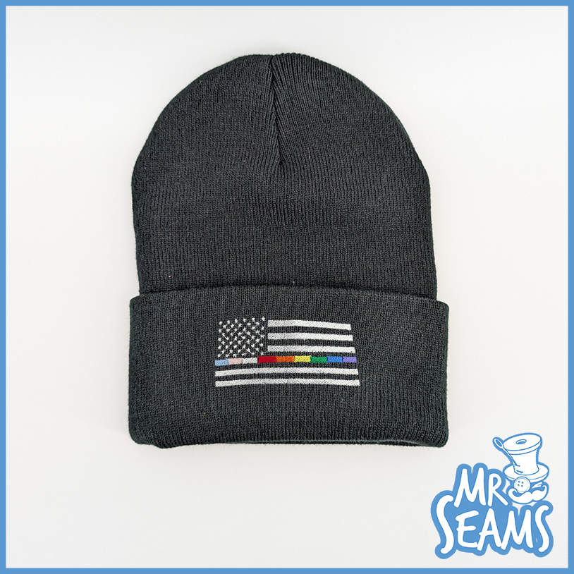 Dark beanie with flag embroidery design.