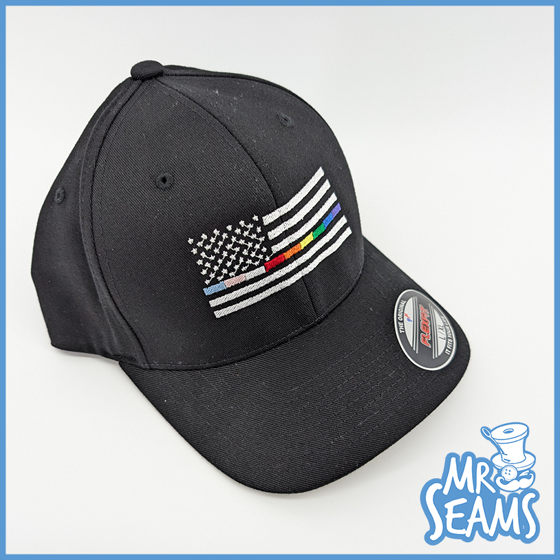 Black cap with embroidered colorful flag.