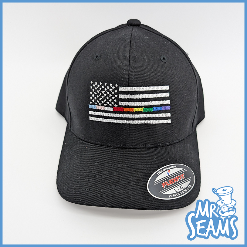 Black cap with rainbow-striped American flag.