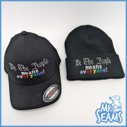 Black hat and beanie with inclusive message.