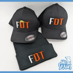 Black caps and beanie with "FDT" logo.