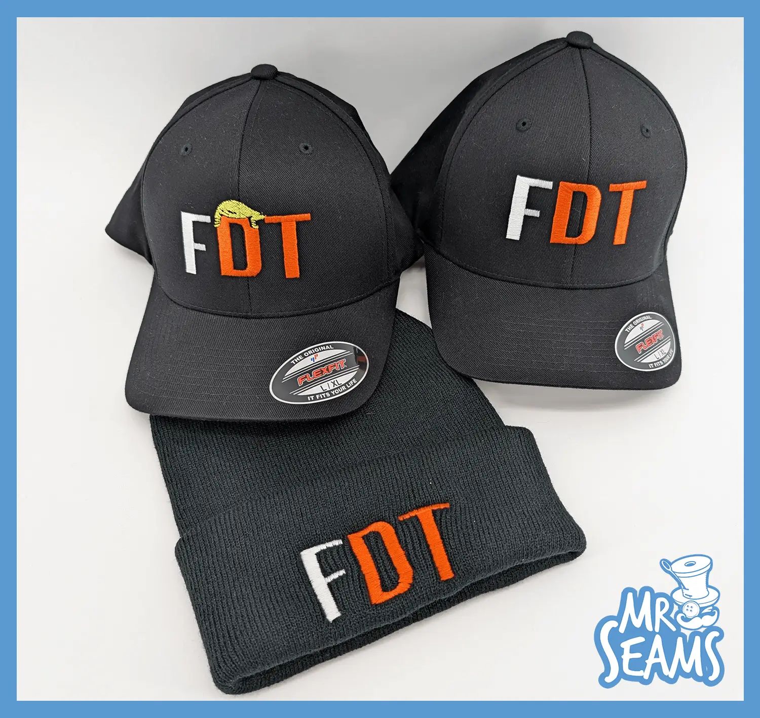 Black caps and beanie with "FDT" logo.