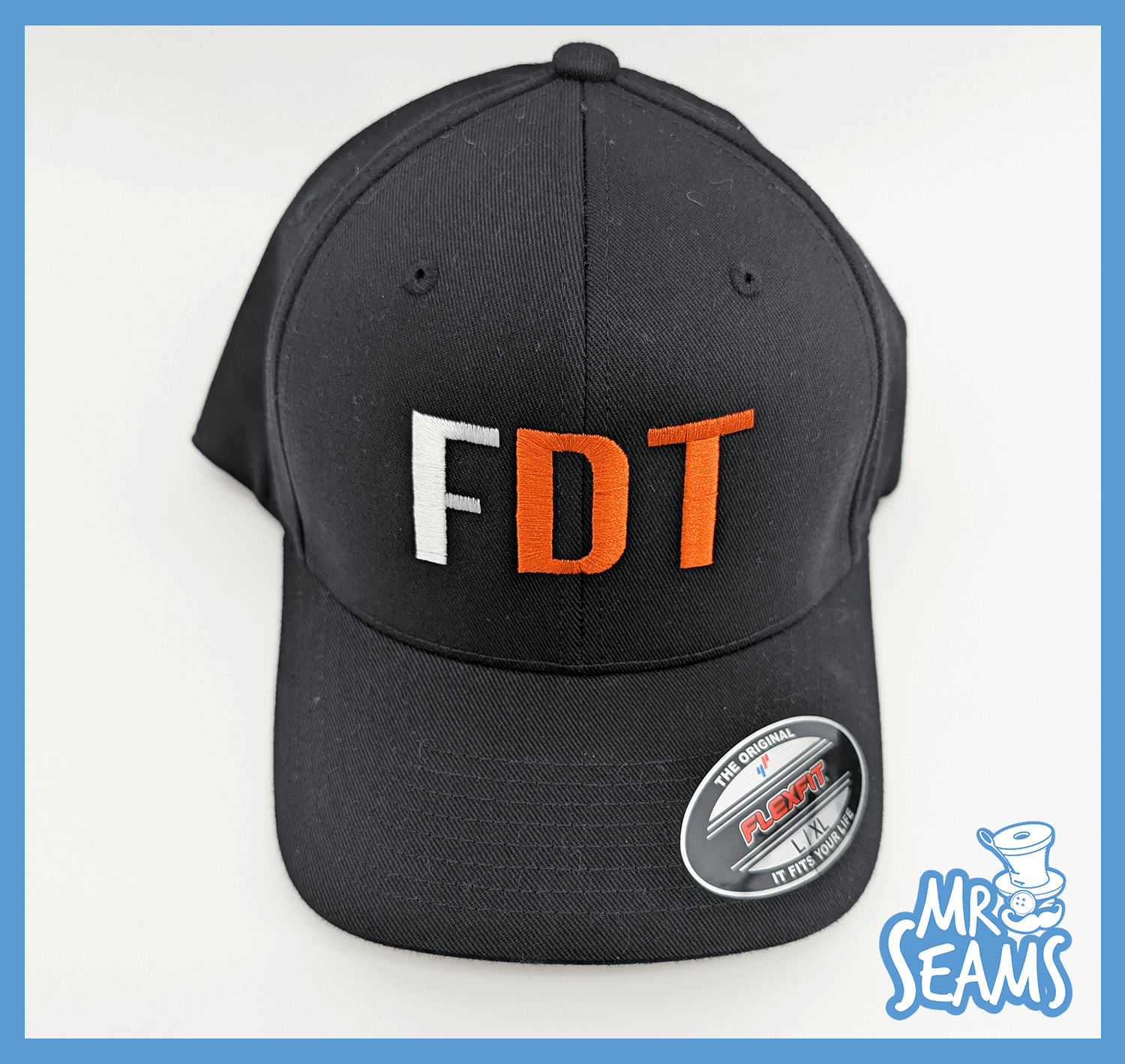 Black cap with "FDT" embroidered letters.