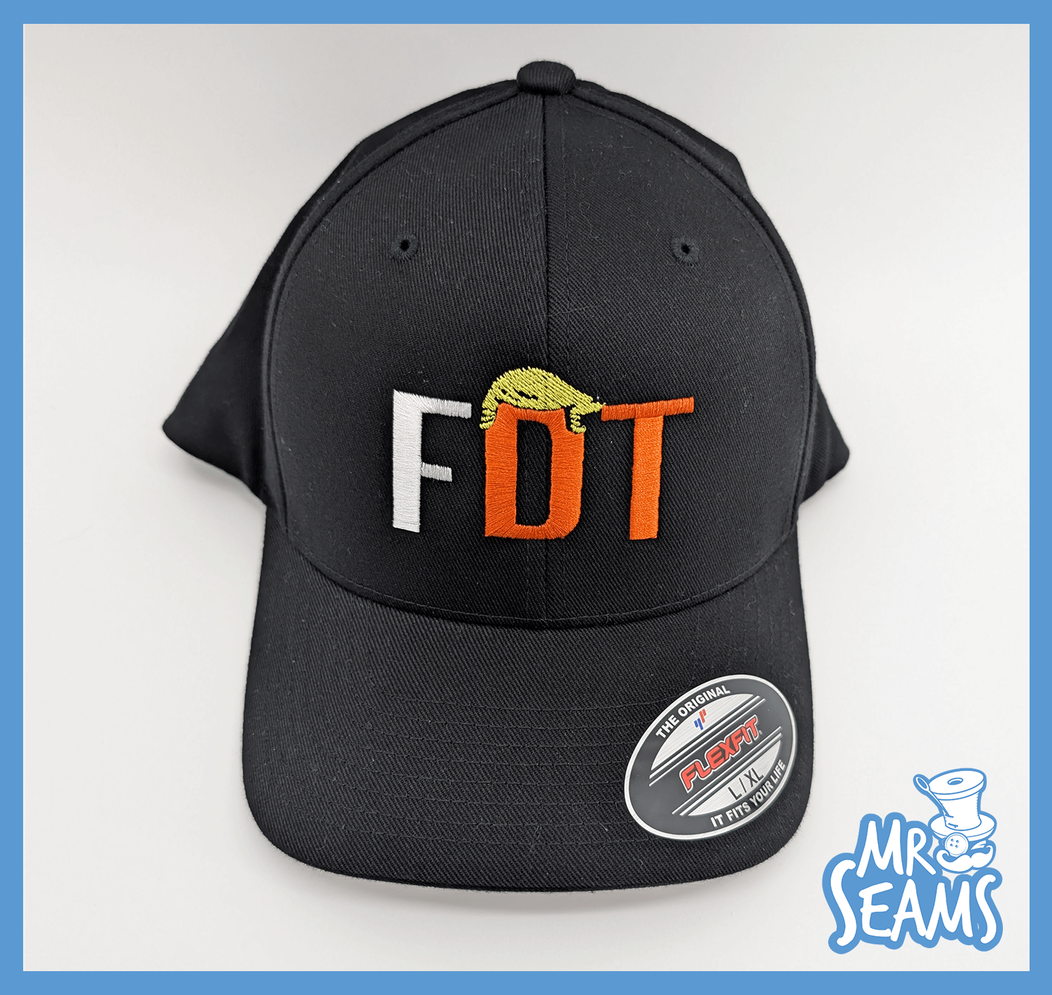 Black cap with "FDT" embroidery design.