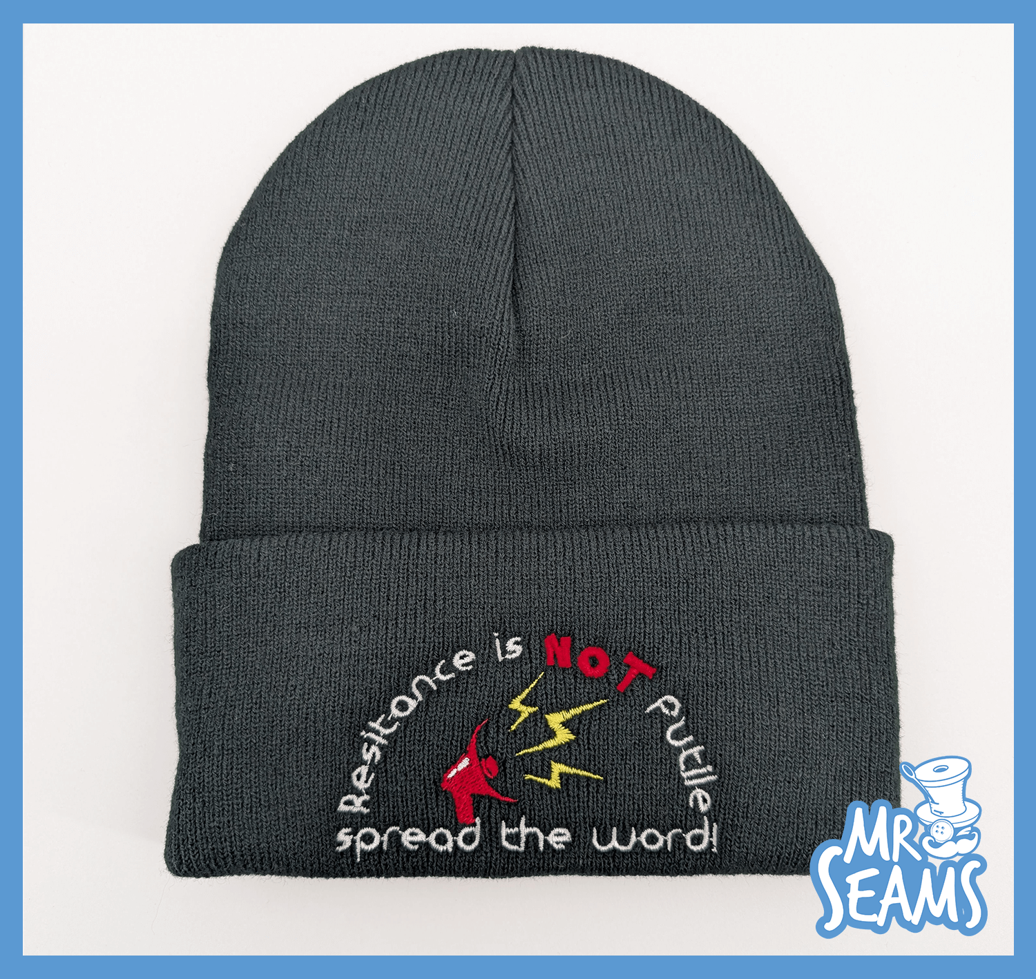 Dark beanie with embroidered resistance message.
