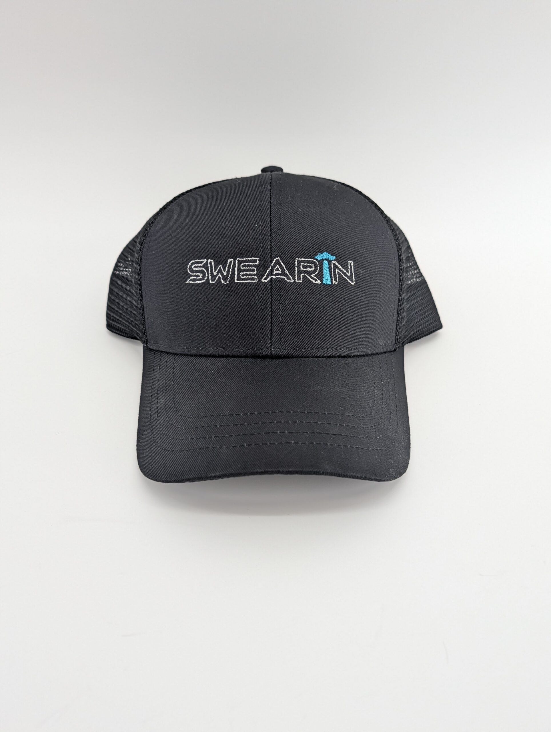 Black cap with "SWEARIN" logo on front.